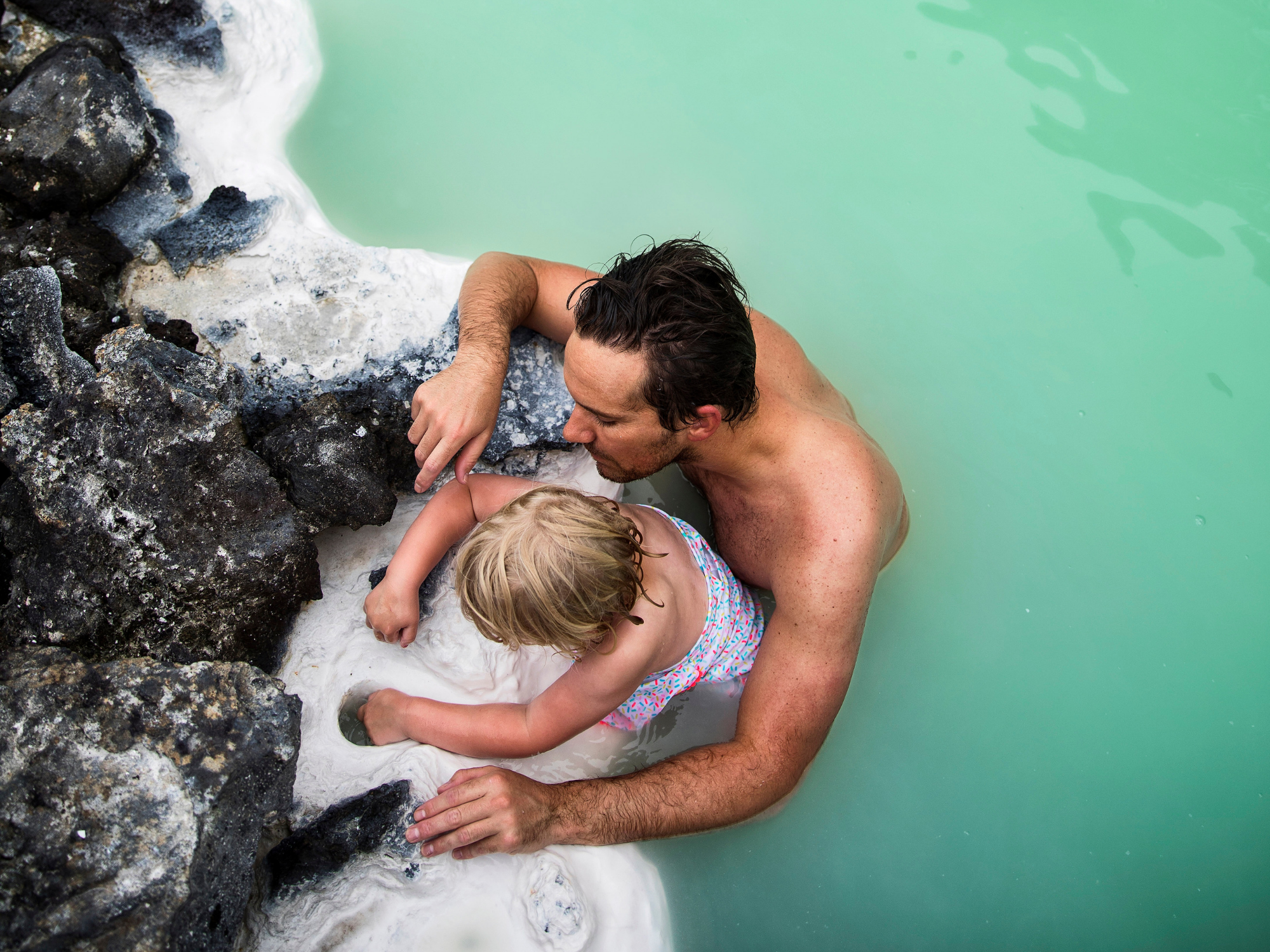 iceland dad swimming with a kid