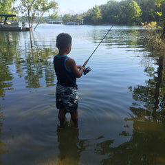 Boy Fishing in River