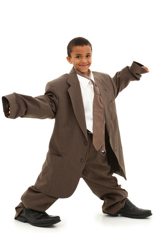 Boy wearing large man's suit