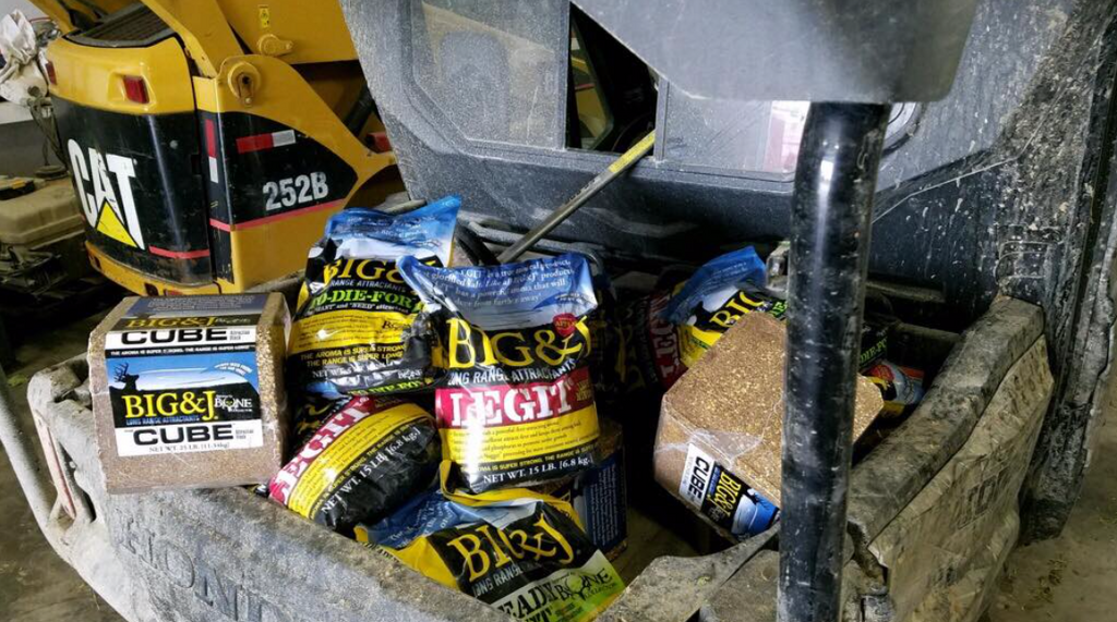 Tractor Bucket full of attractant and minerals