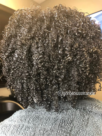 curls after receiving a detox treatment