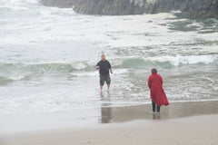 my son getting water from the ocean for his mom 2
