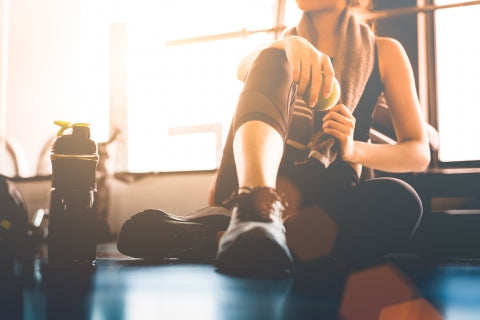 Image of a woman relaxing after a tough workout.