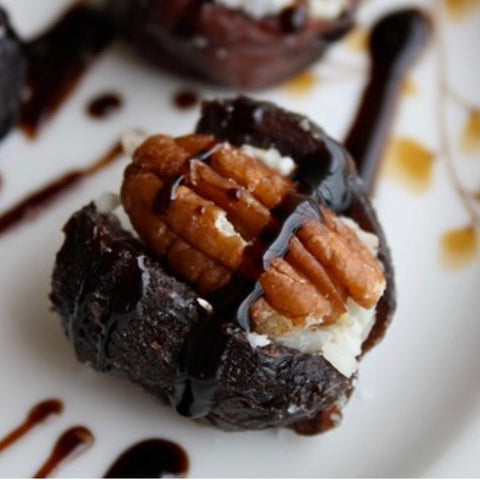 Cheese stuffed fig with pecan and balsamic drizzle