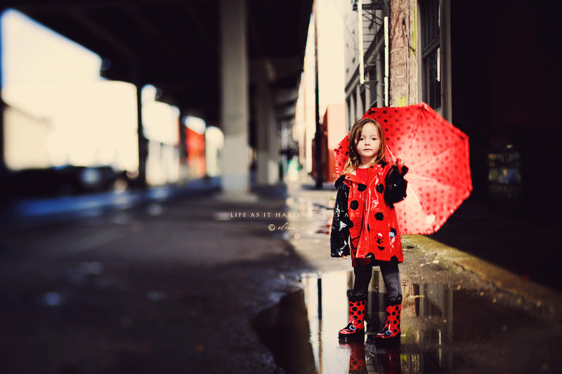 ew9-girl-in-raincoat-and-rain-boots