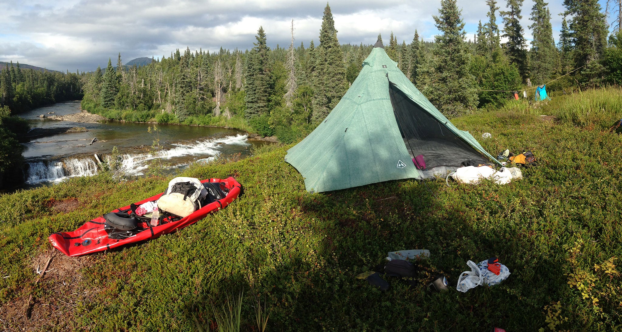 Backcountry camp setup near a river