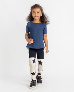 Navy coloured short-sleeve tee and ruched leggings with a star-print shown on a girl.