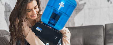 The best home water coolers. Woman hugging water cooler.