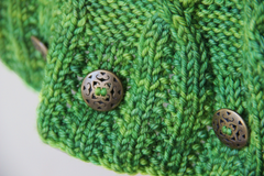 detail of green cabled cowl
