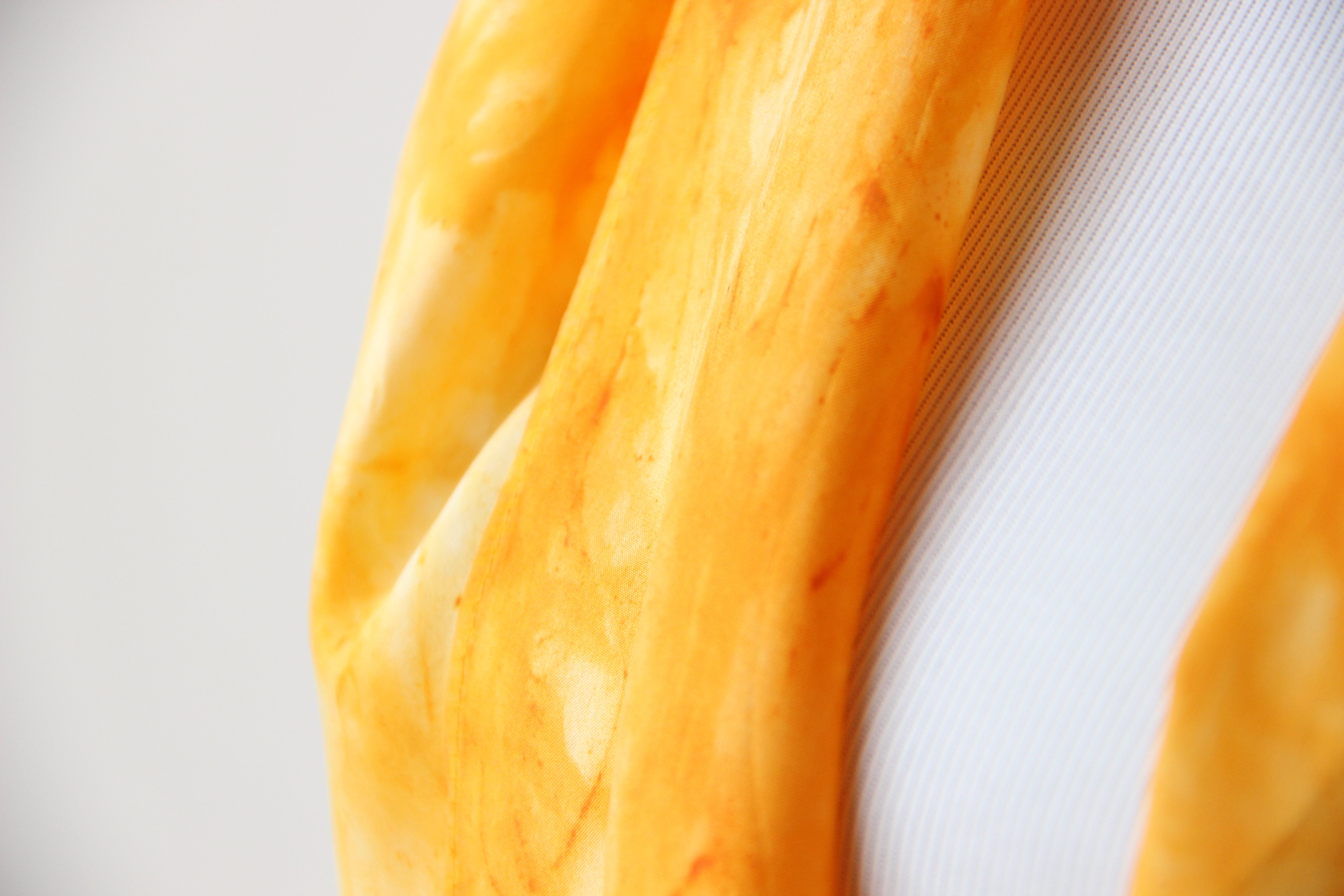 close up of yellow silk scarf