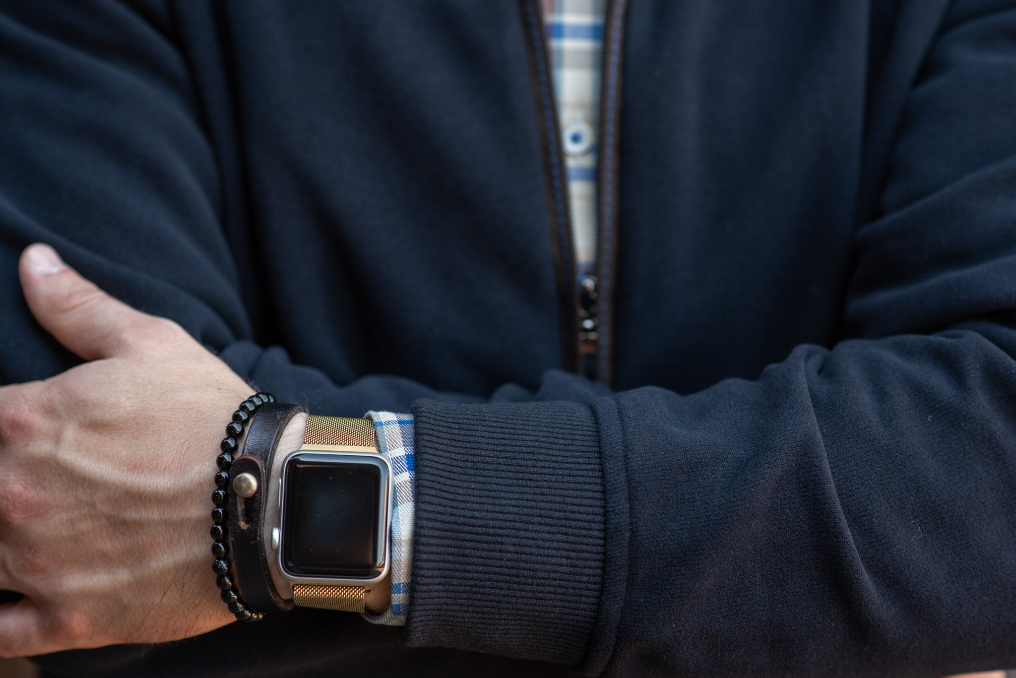 apple watch with bracelets and sweater