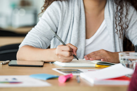 Woman writing a to-do list