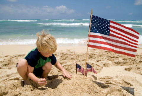Kids play at beach on Labor Day Weekend - enjoy the end of summer