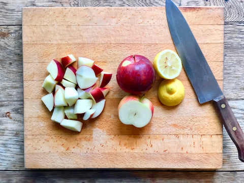 Empire apples and organic lemon sliced for homemade applesauce. 
