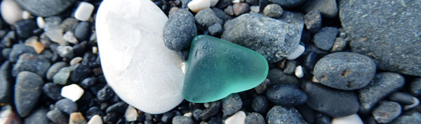 teal aquamarine sea glass on beach