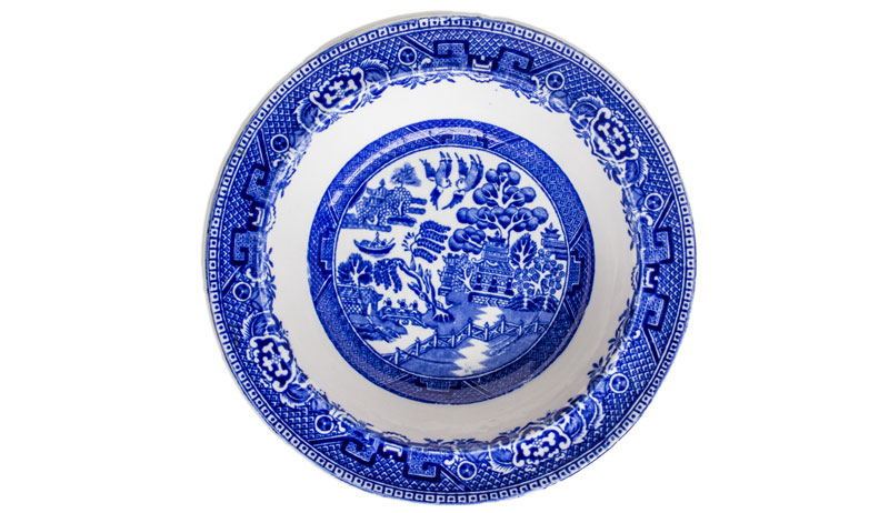 pottery plate with blue willow design