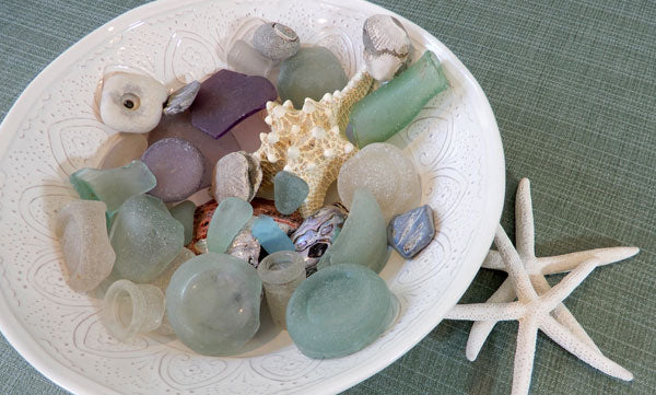 sea glass and shells in a bowl