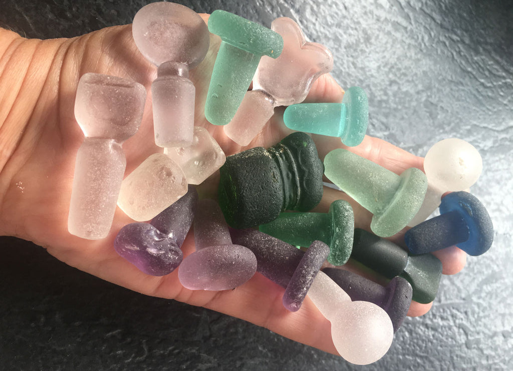 sea glass stopper collection in hand