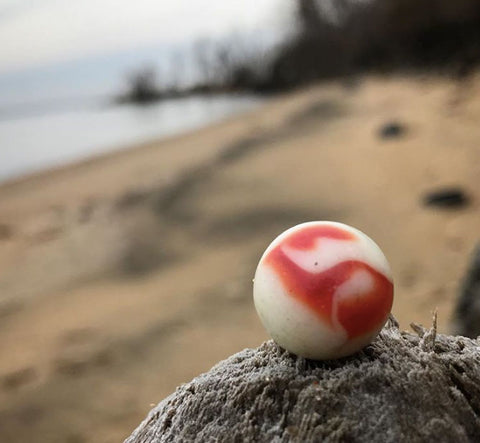 red swirl sea glass marble