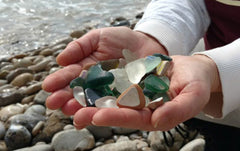 handful of Italian sea glass on the beach