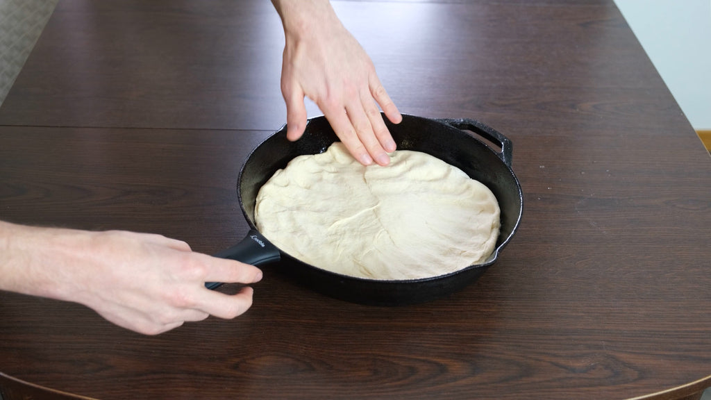 put the dough into the cast iron skillet pan