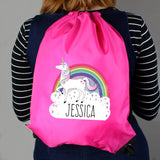 Personalised Pink Unicorn and Rainbow Drawstring Kit Bag for Back to School, worn on girls back in image