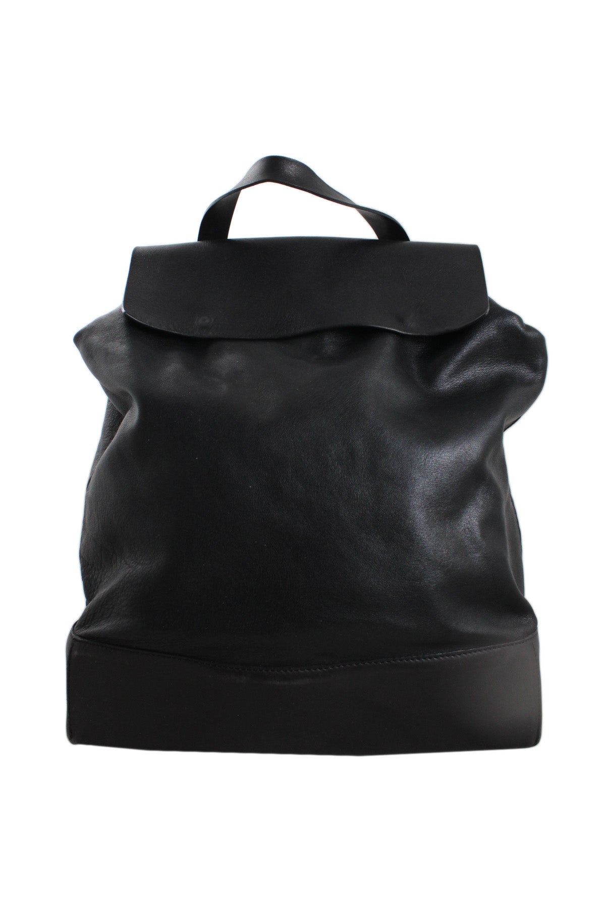 cos black leather backpack. features flap top, zip pocket at interior, fully lined, and snap button closure.