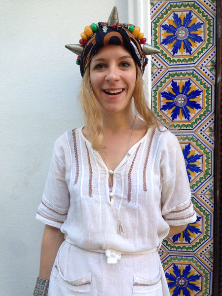 julia smiling wearing a headpiece.