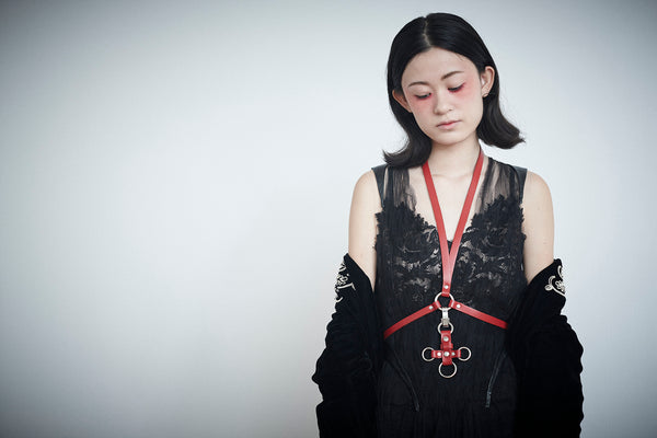 stunning model with red leather harness.