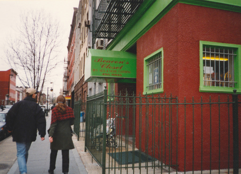 beacon's storefront williamsburg 1997, red building with green awning, two people walking away from the camera