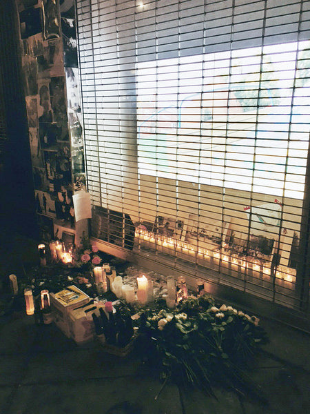 memorial with flowers and candles on fairfax avenue.