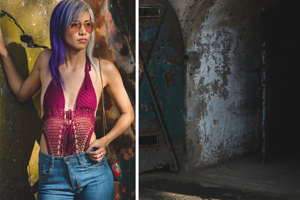 model posing in crochet one piece and jeans.