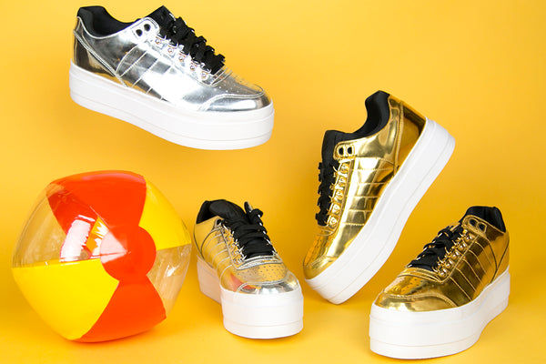 still life of metallic platform sneakers.