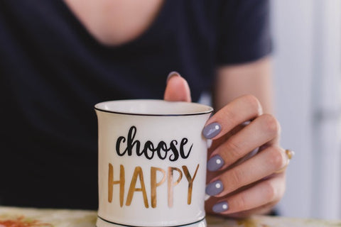 girl holding mug with text choose happy eve and elle