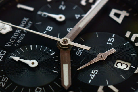 Gears on a time piece watch in black and wood