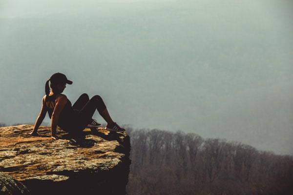 woman sitting on mountain eve and elle