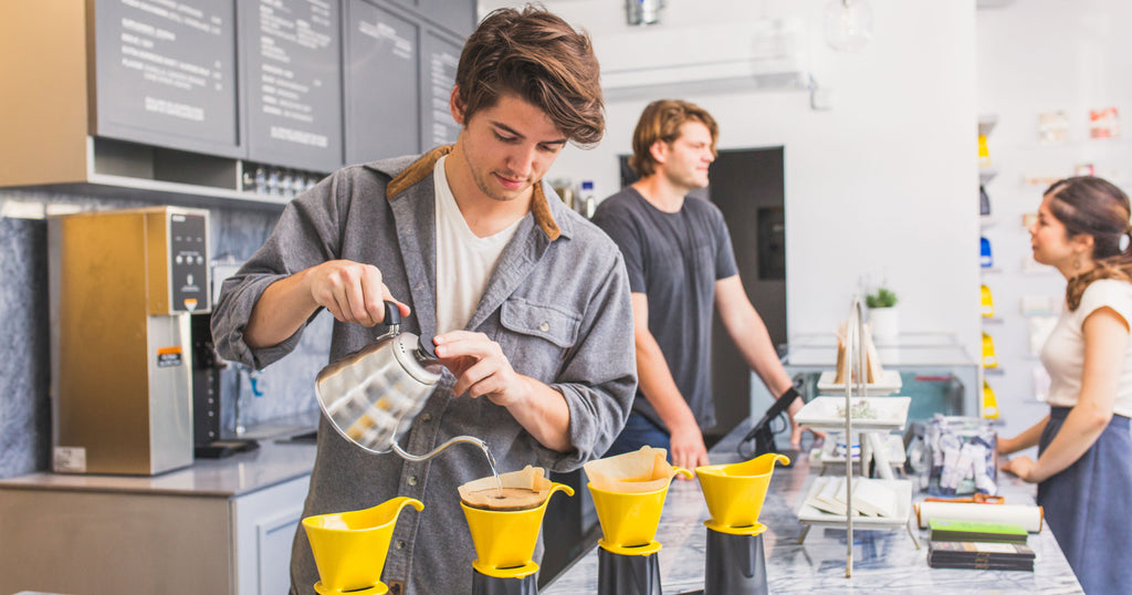 man making pour over coffees at caffe luxxe