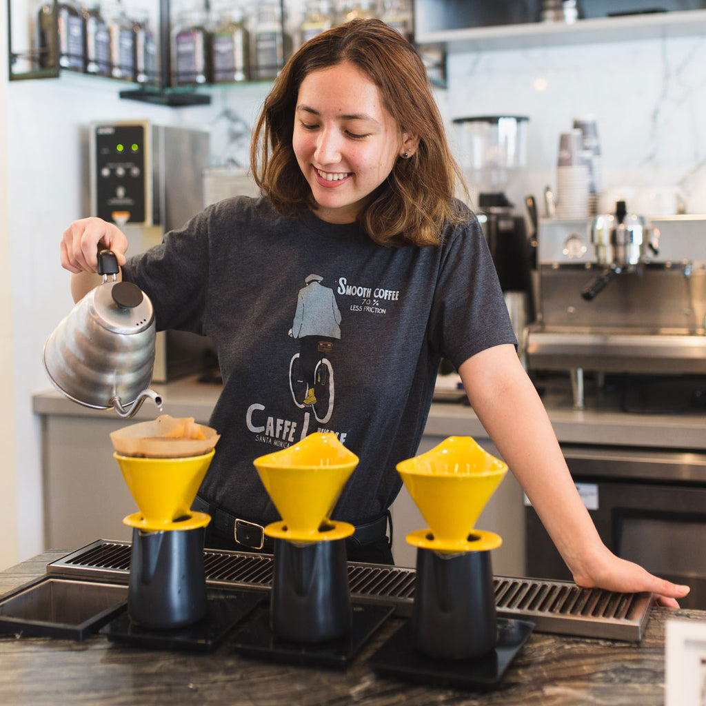 woman making pour over coffee
