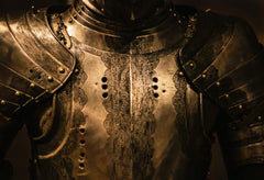 close up photo of metal armor suit the chest Photo by Nik Shuliahin on Unsplash