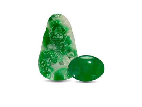 Jade carving and rounded green jade stone
