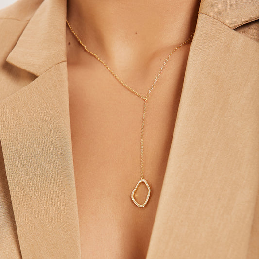 Paola gold drop necklace with sculptural white zirconia stone pendant