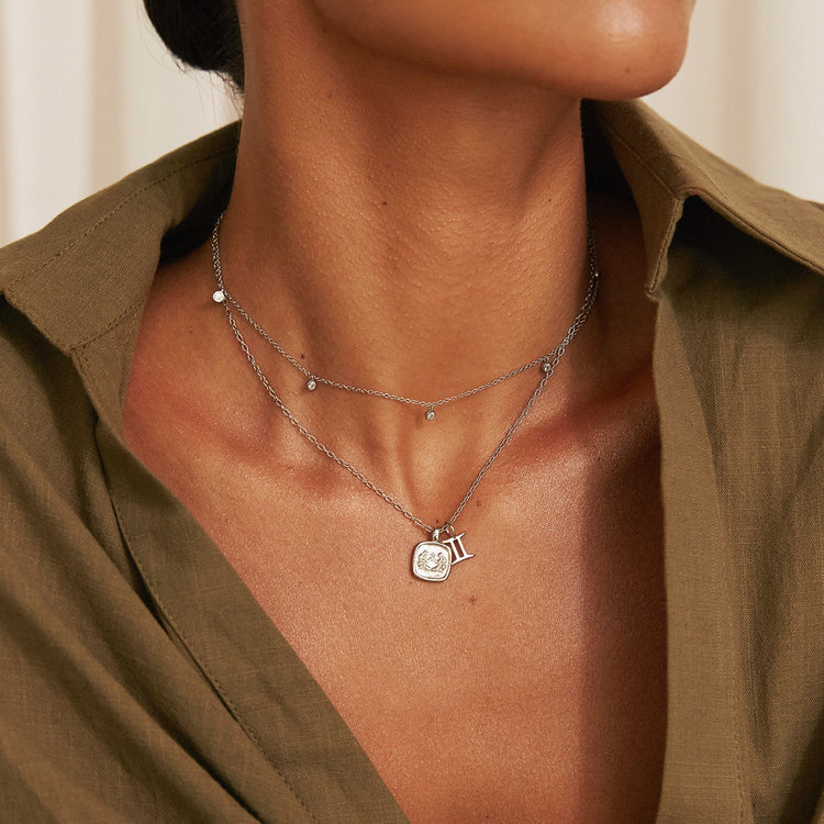 zodiac gemini necklace with zodiac charm layered with niki dainty silver choker