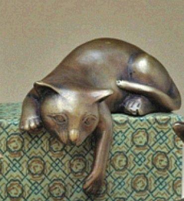 Our adorable bronze cat is taking a lazy nap on a ledge in this sculpture created for the home and garden.