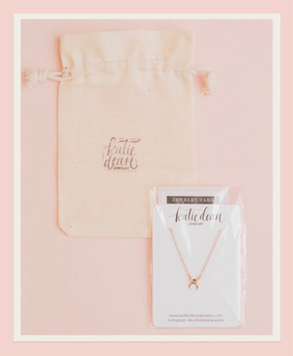 Katie Dean Jewelry necklace and pouch.