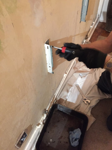 removing a radiator from the wall to decorate behind