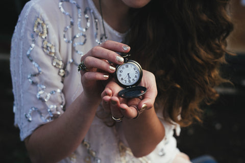 Woman holding pocket watch 