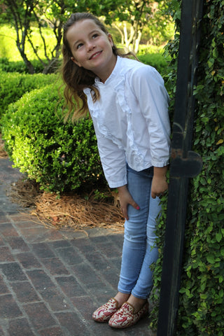 caroline outside in sumak kilim loafers, part of childrens shoes collection.