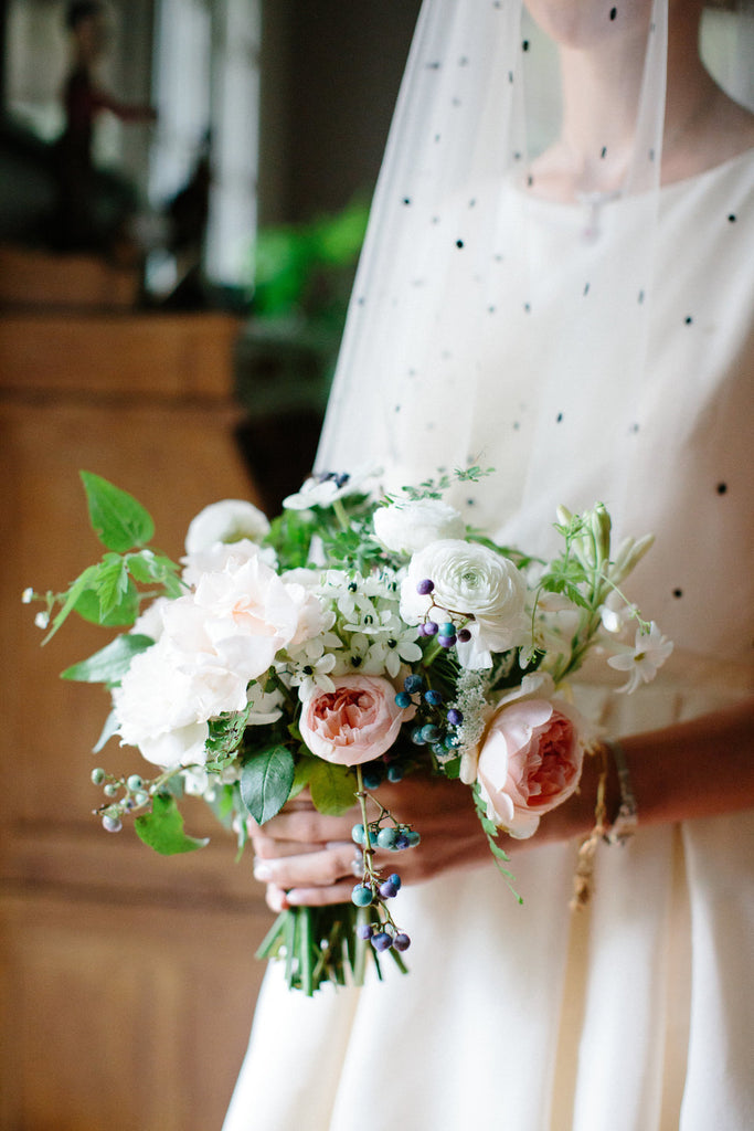 Photo of the brides bouquet. Bouquet is made up of roses and babies breath.
