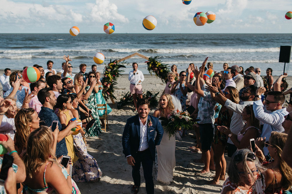 John Craddock and his wife walking down the isle in Men's Kilim loafers.