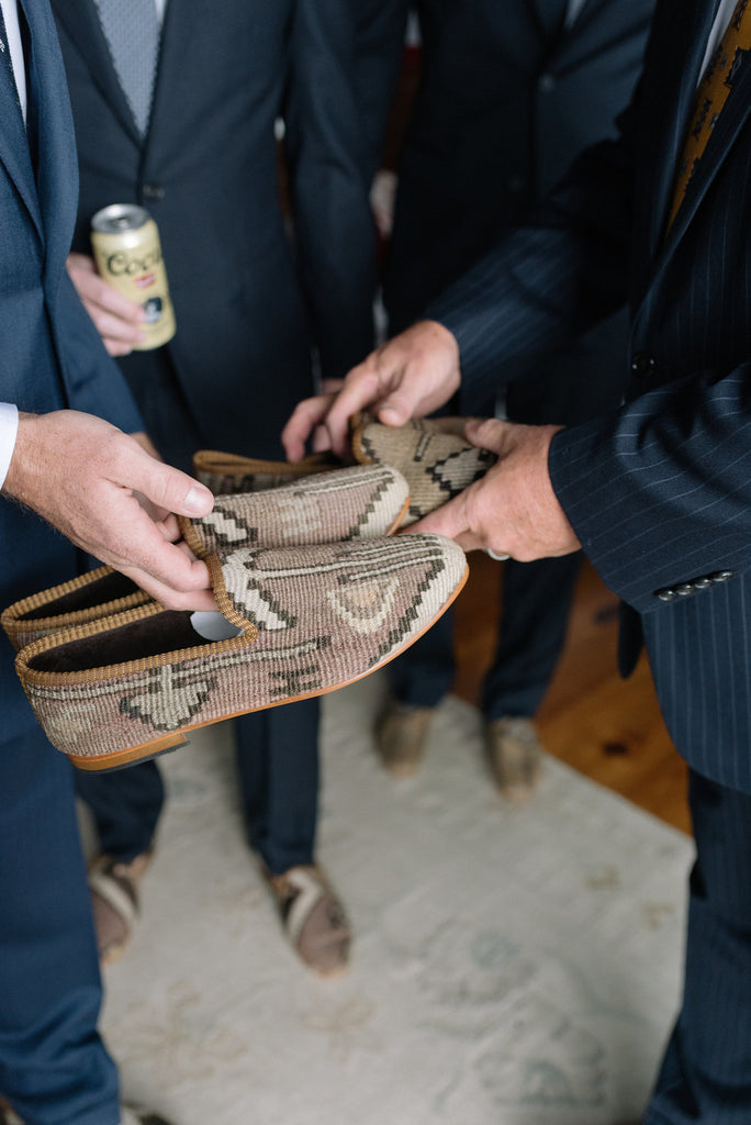 Groomsmen getting ready in there custom mens kilim loafers.